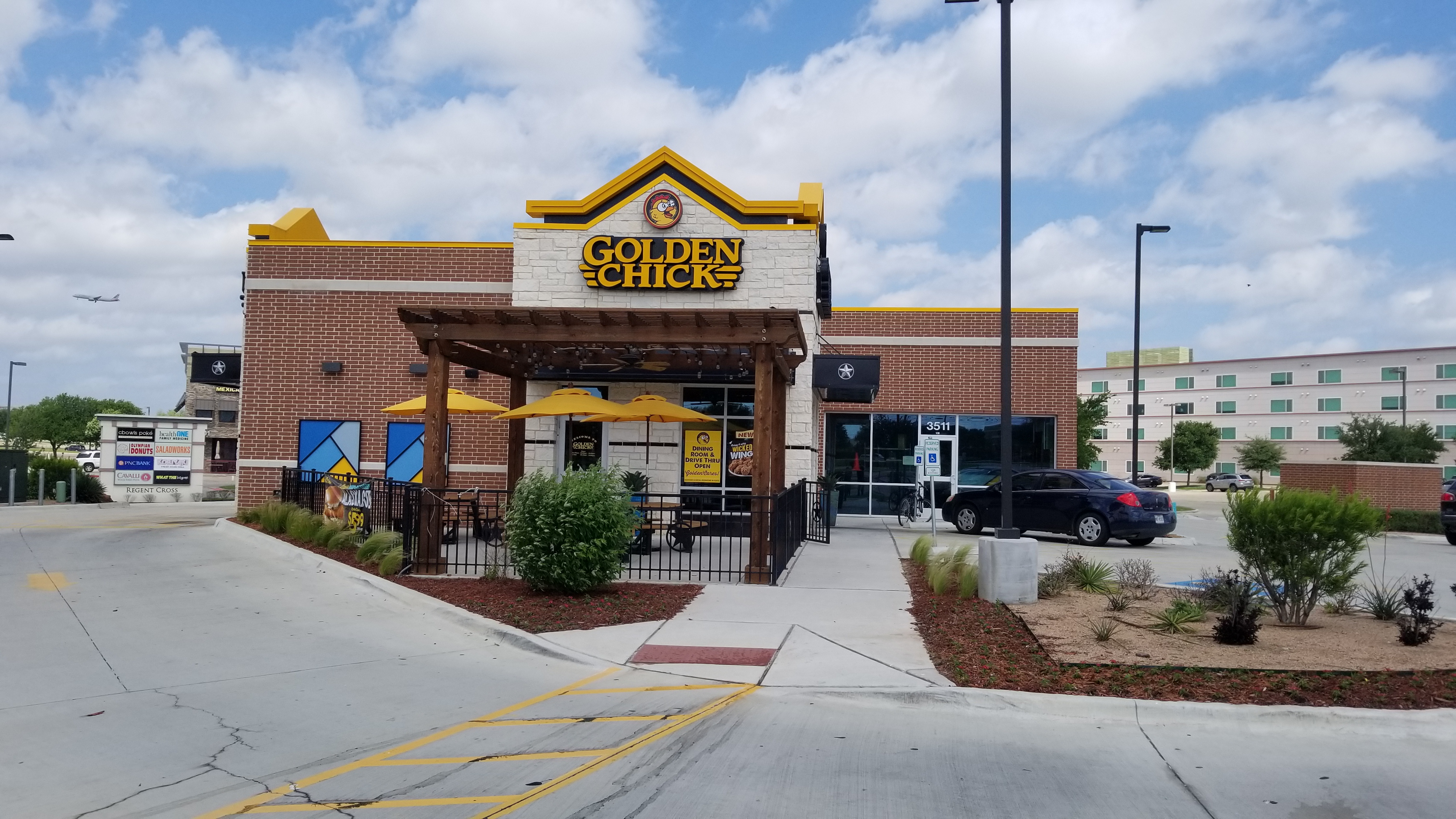 Golden Chick storefront.  Your local Golden Chick fast food restaurant in Irving, Texas