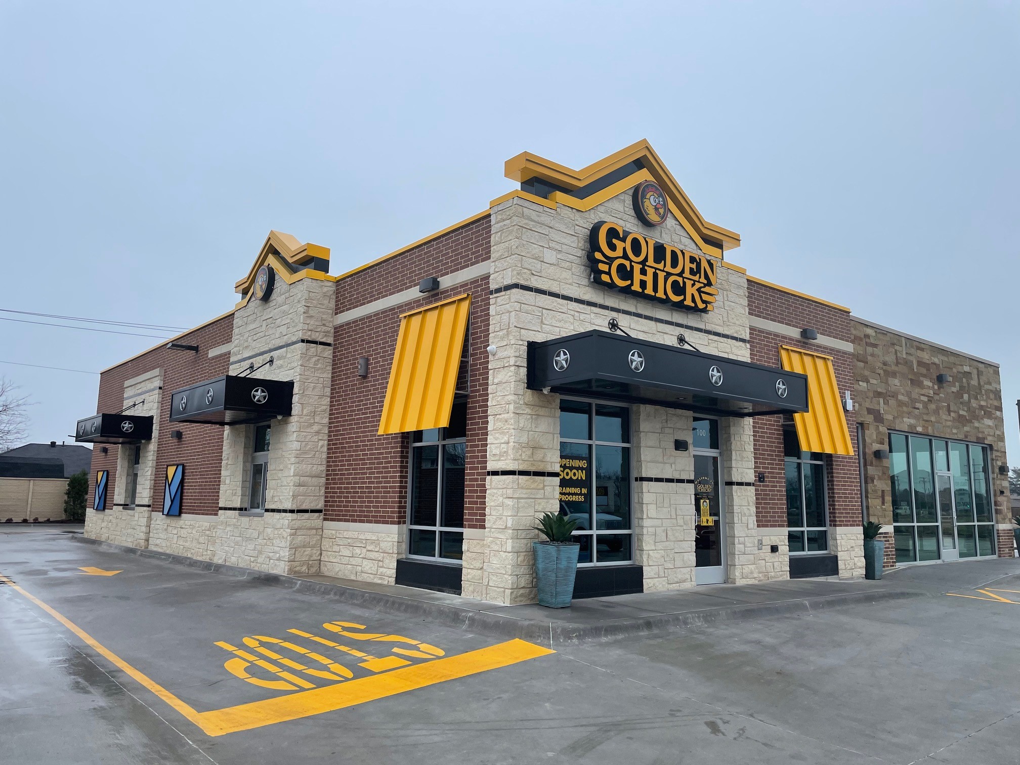 Golden Chick storefront.  Your local Golden Chick fast food restaurant in Rowlett, Texas