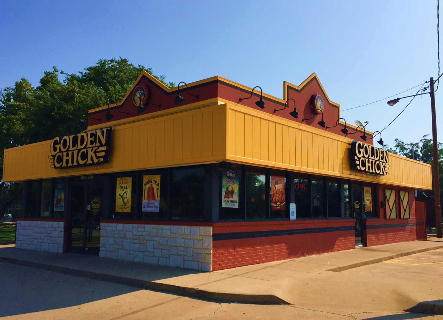 Golden Chick storefront.  Your local Golden Chick fast food restaurant in Denton, Texas