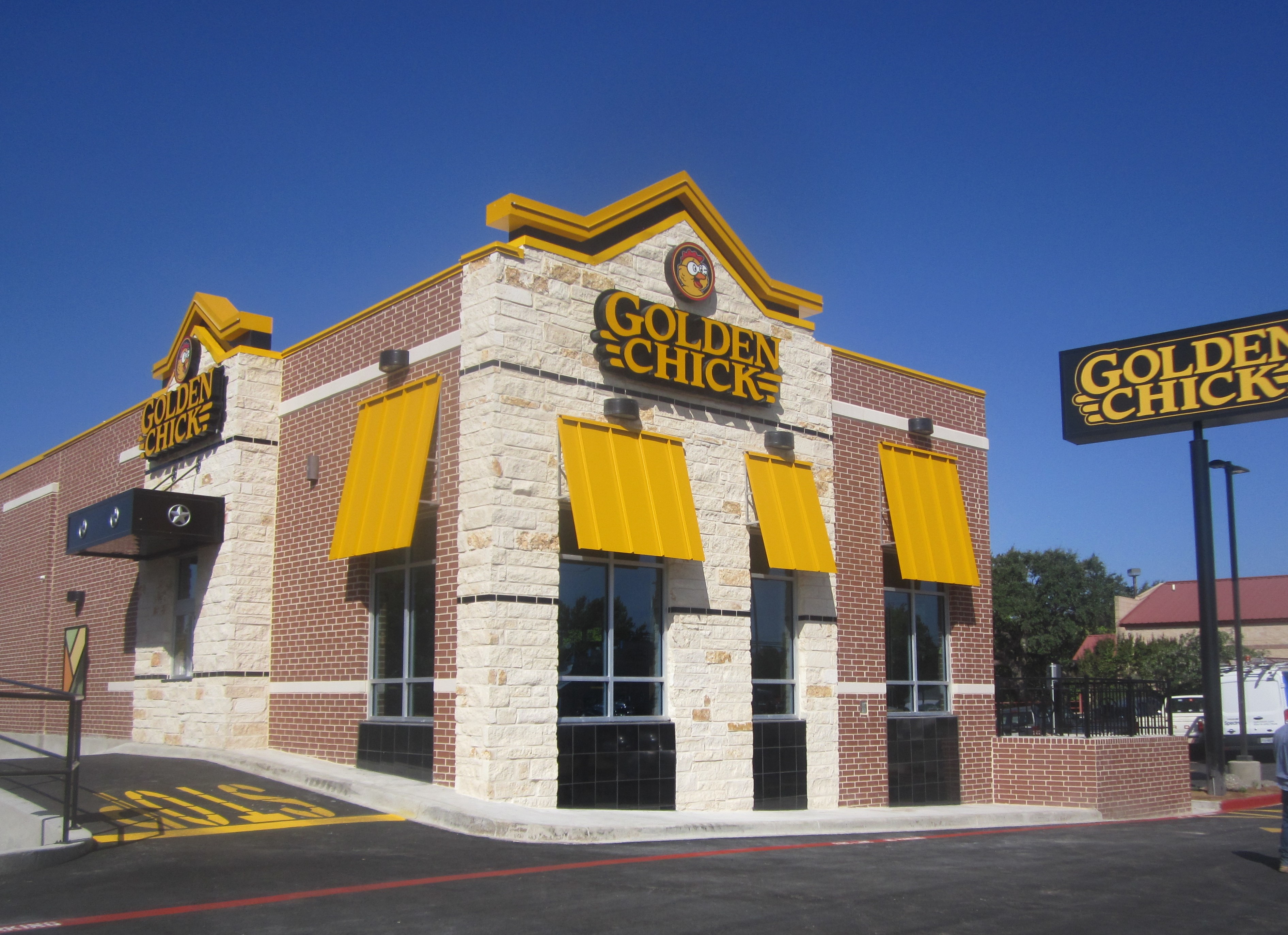 Golden Chick storefront.  Your local Golden Chick fast food restaurant in Kerrville, Texas